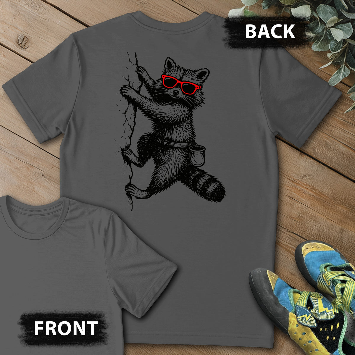 Raccoon Chillin Up a Cliff Backprint Tee in Charcoal — flat lay mockup