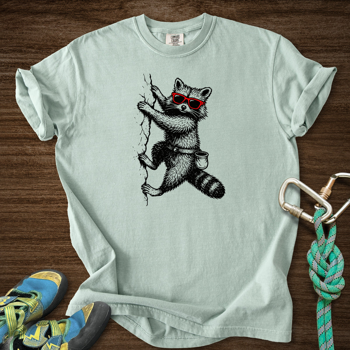Raccoon Chillin Up a Cliff Premium in Bay — flat lay mockup