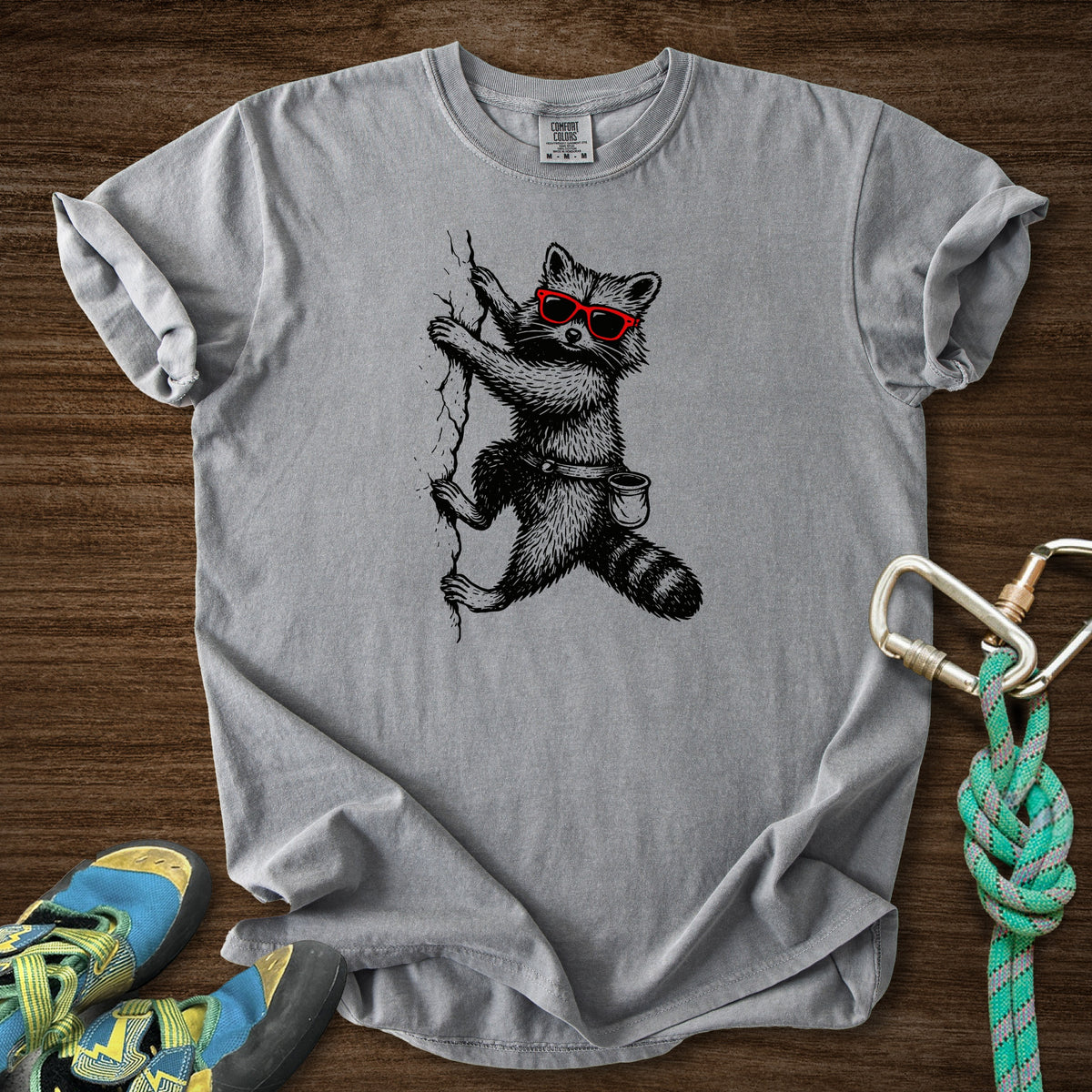 Raccoon Chillin Up a Cliff Premium in Grey — flat lay mockup