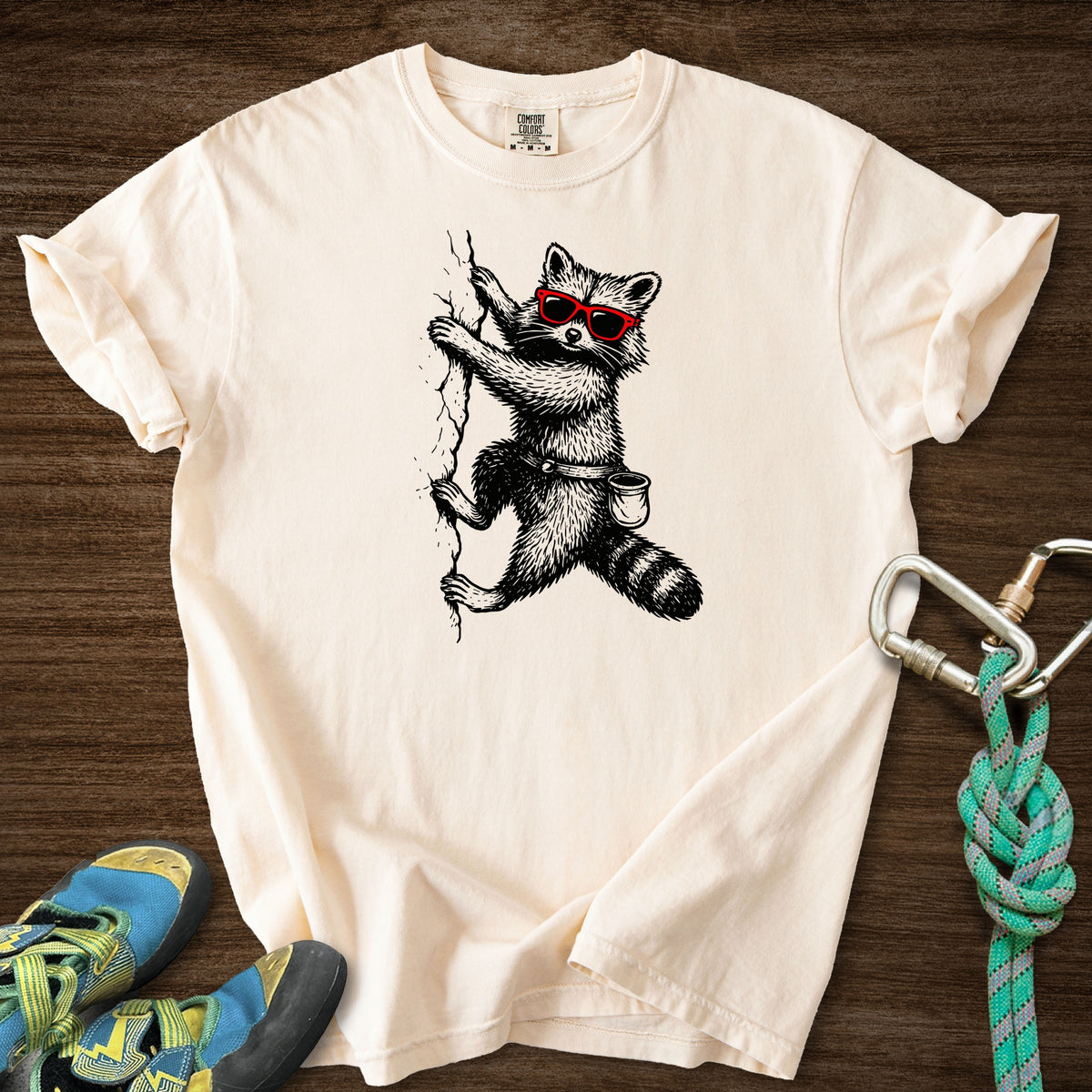 Raccoon Chillin Up a Cliff Premium in Ivory — flat lay mockup
