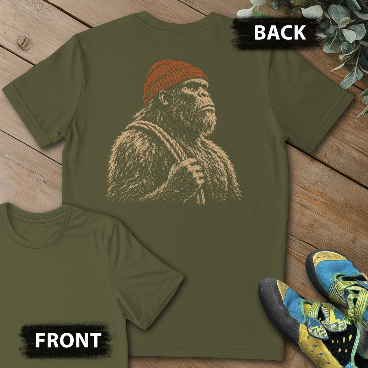 Sasquatch Reading Beta Beanie Backprint Tee in Military Green — flat lay mockup